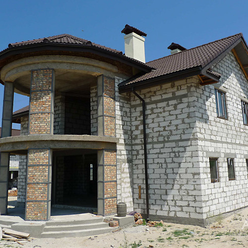 House photo before during construction works